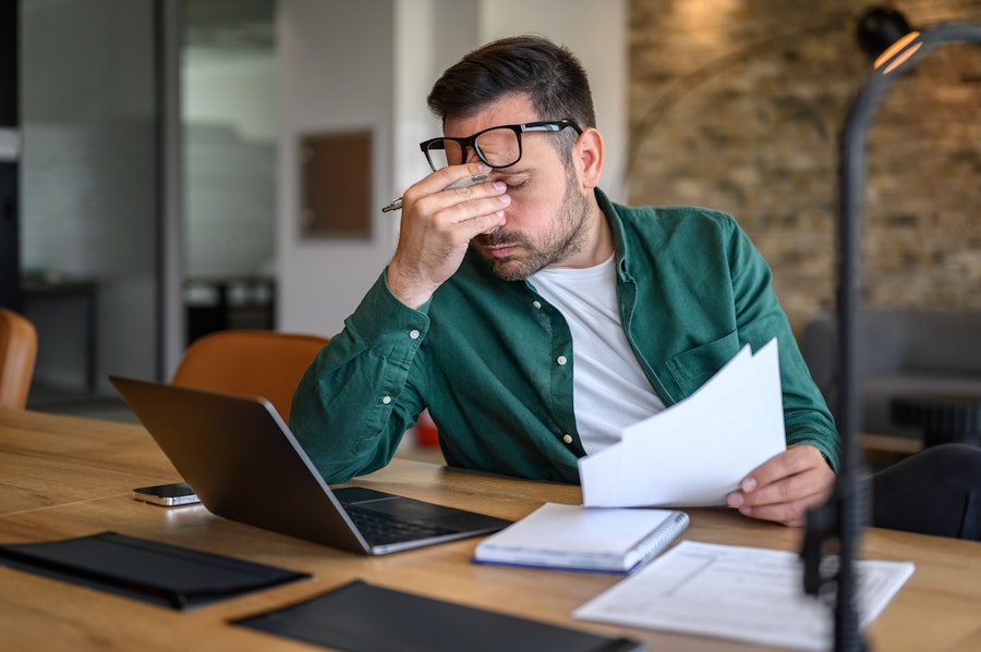 A man agonising over finances